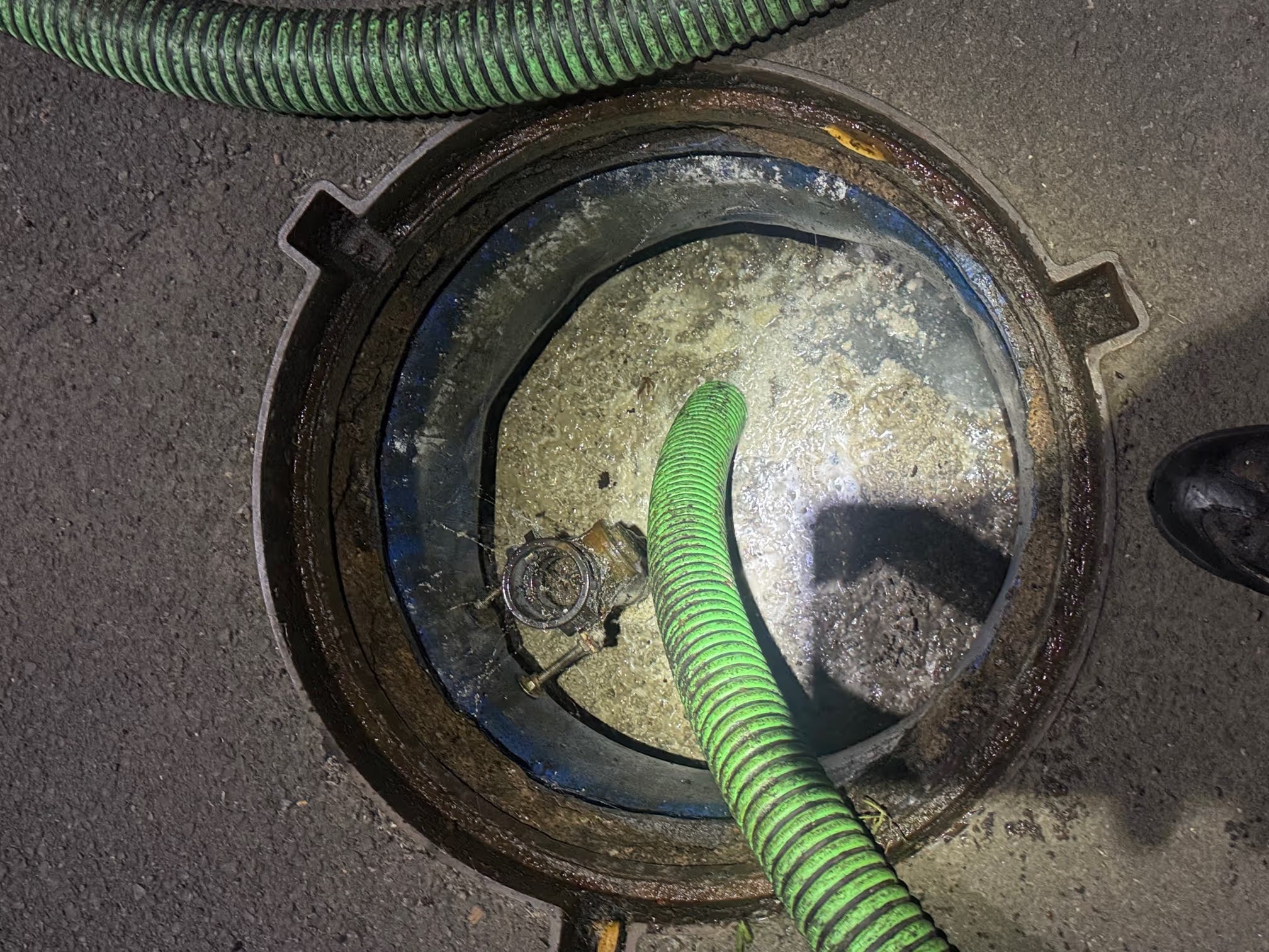 Scheduled grease trap servicing for a commercial kitchen
